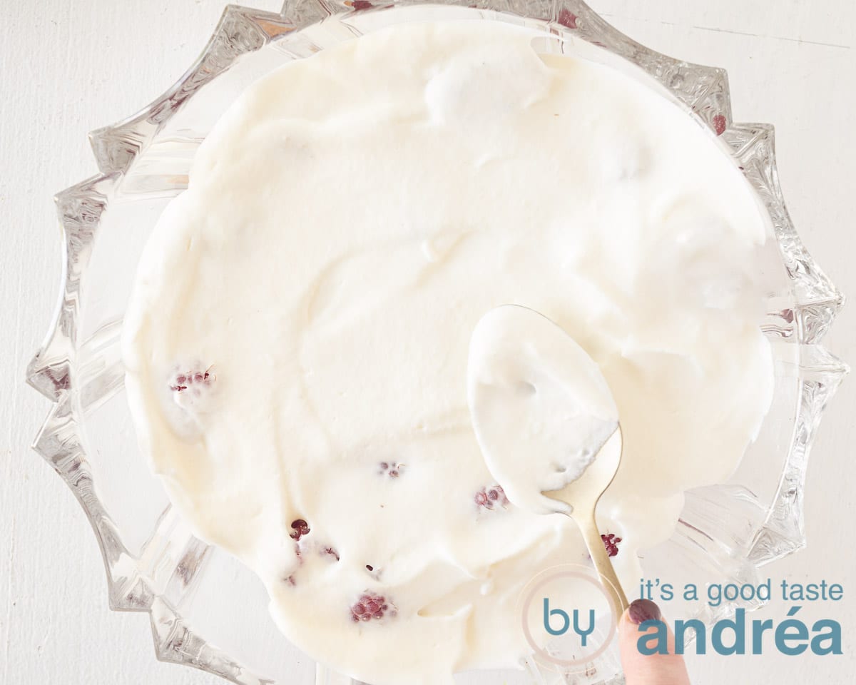 Cover the raspberries with a layer of vanilla whipped cream.