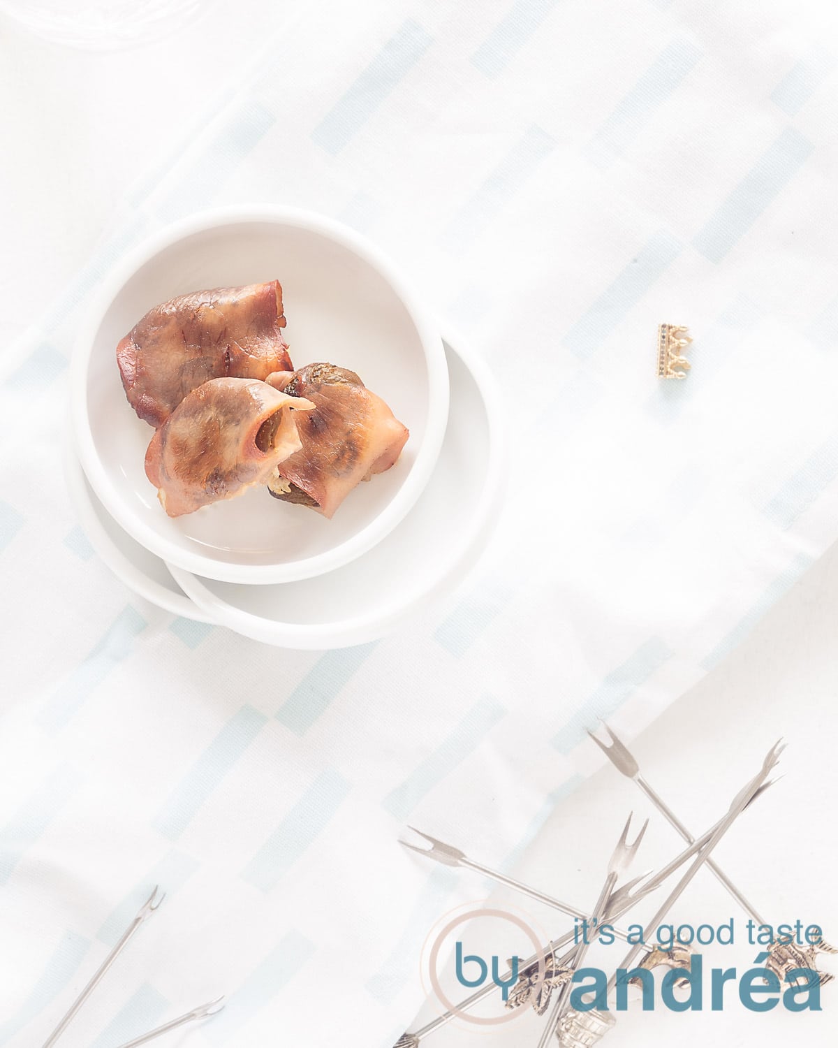 Photo from above three white bowls filled with three apricot goat cheese snacks. At the bottom some prickers
