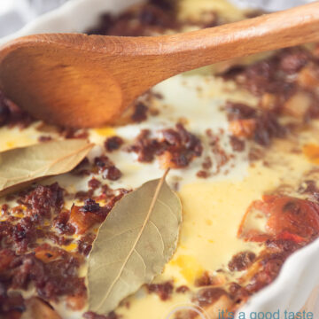 a casserole with bootie on a wooden board