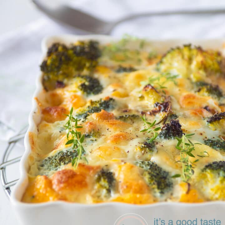 a white casserole dish filled with frittata with mozzarella and broccoli. A sppon in the background