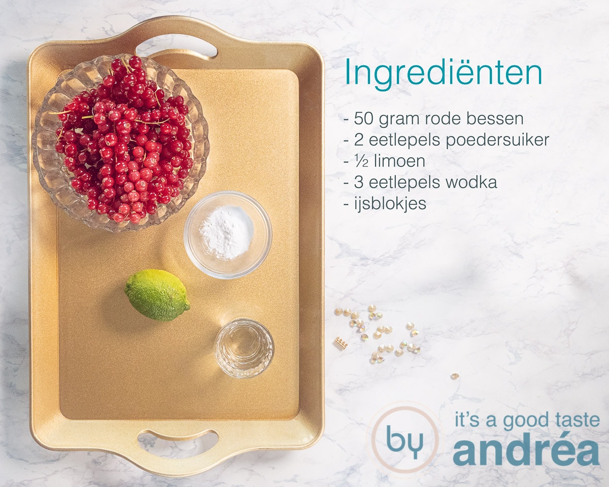 Ingrediënten voor een caipirinha met rode bessen