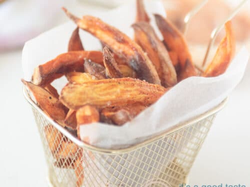 A square photo with a bowl filled with sweet potato fries