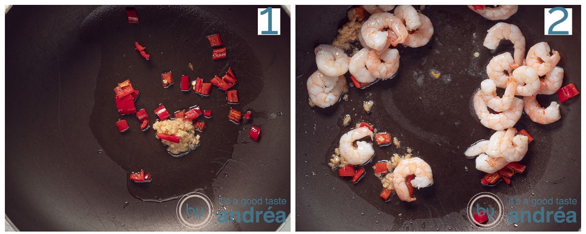 a frying pan with garlic and red pepper and shrimp that are fried.