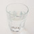 A glass filled with water on a white background