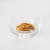 Curry powder in a glass bowl on a white background