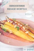 Een deel van een roze bord met geroosterde Indiase wortels met Garam masala, noten en peterselie. Bovenin een tekst: bijgerecht, geroosterde Indiase wortels, makkelijk recept