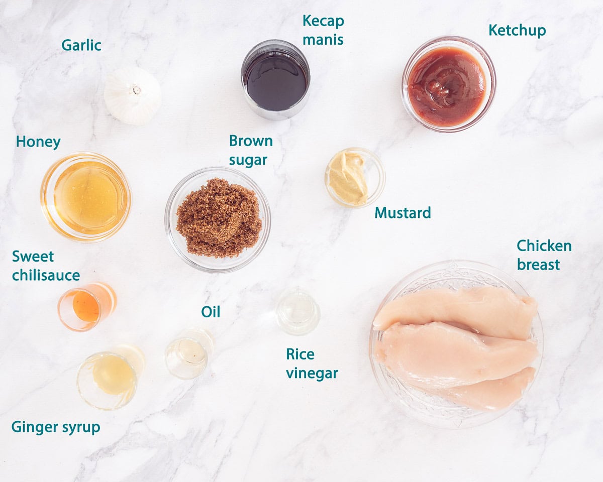 Ingredients Sticky Chicken in Sweet Ketjap Sauce on a white background with text description.